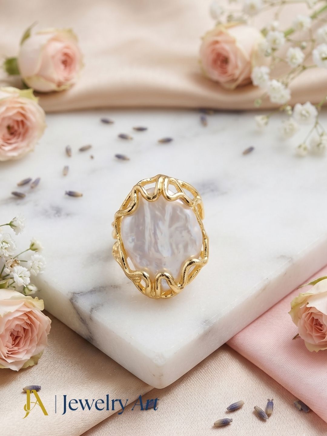Handcrafted gold plated Baroque Pearl ring for women displayed in a luxury decorative jewelry setup with elegant props, highlighting the artistic design and artisan craftsmanship.
