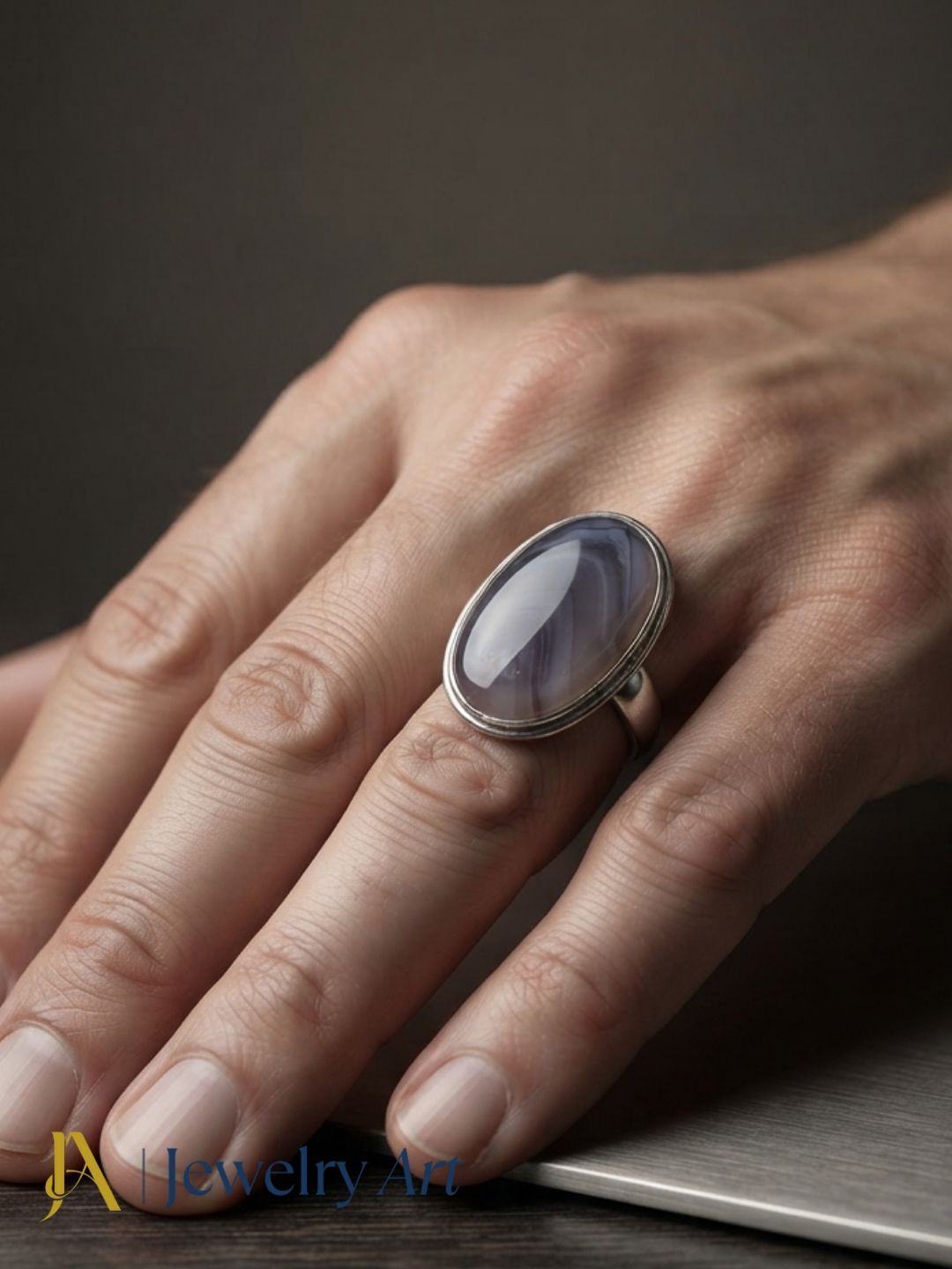 Male model wearing a handmade silver plated GS Agate stone statement ring, showcasing the natural gemstone and artisan craftsmanship with an elegant, contemporary fashion look.
