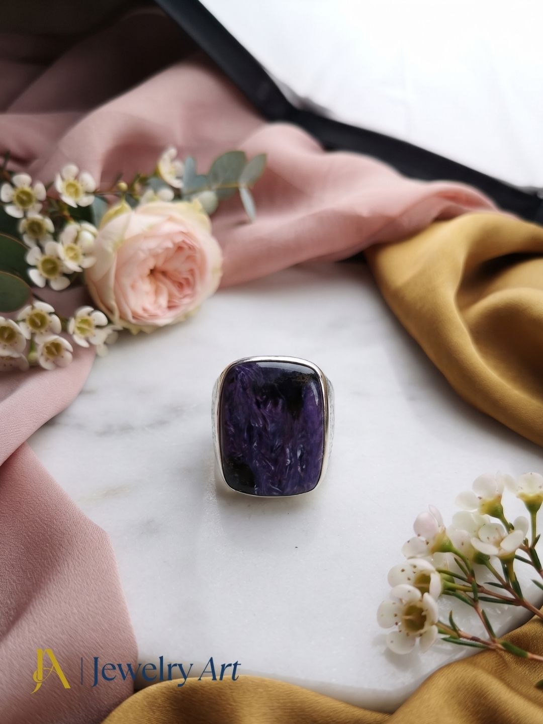 Elegant Natural Charoite silver plated ring in premium jewelry display
