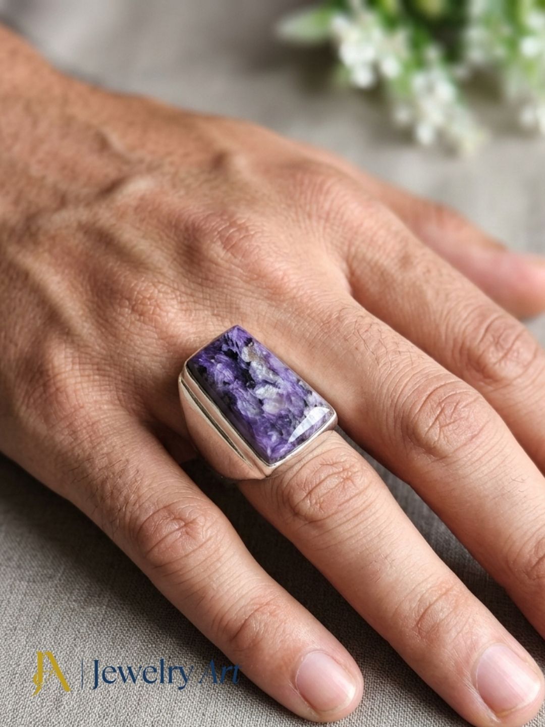 Hand model displaying Stylish Charoite gemstone designer ring
