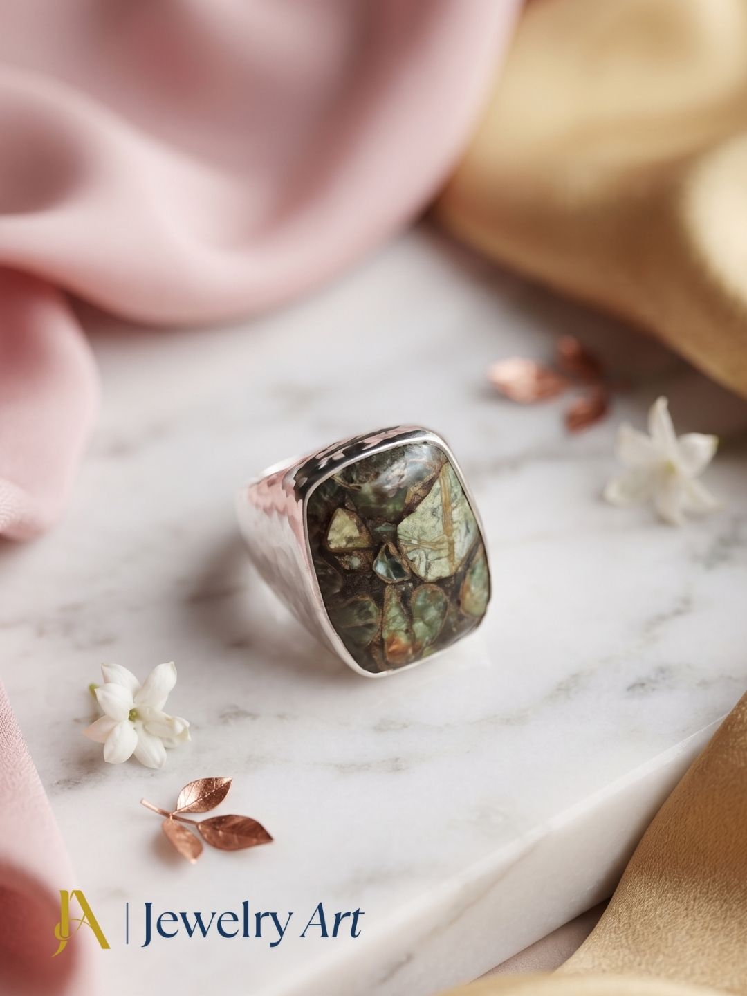 Handmade natural Copper Chrysocola gemstone ring for men in silver plated GS displayed in a luxury decorative jewelry setup with elegant props and premium lighting.
