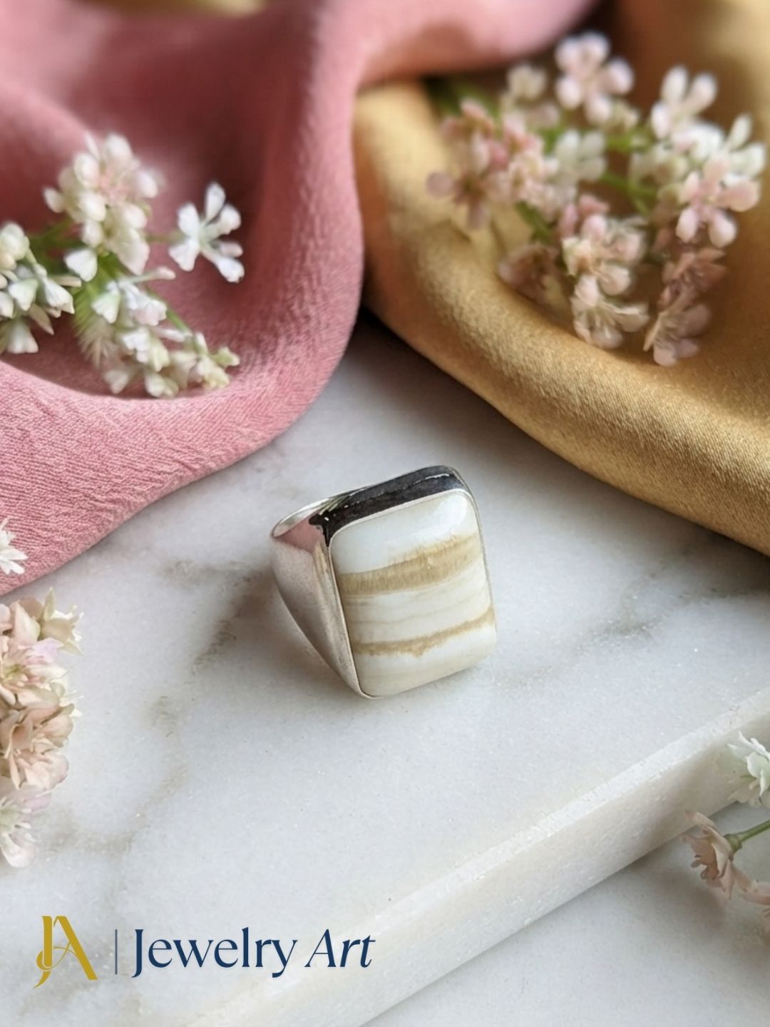 Handcrafted Jasper gemstone ring for men in silver plated GS displayed in a luxury decorative jewelry setup with elegant props and premium lighting.
