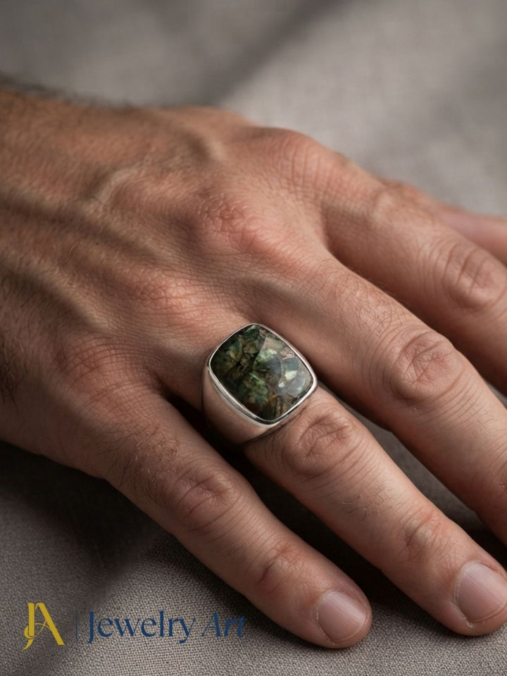 Male model wearing an artisan Copper Chrysocola gemstone silver plated GS designer statement ring, showcasing premium handcrafted craftsmanship with modern men's fashion styling.
