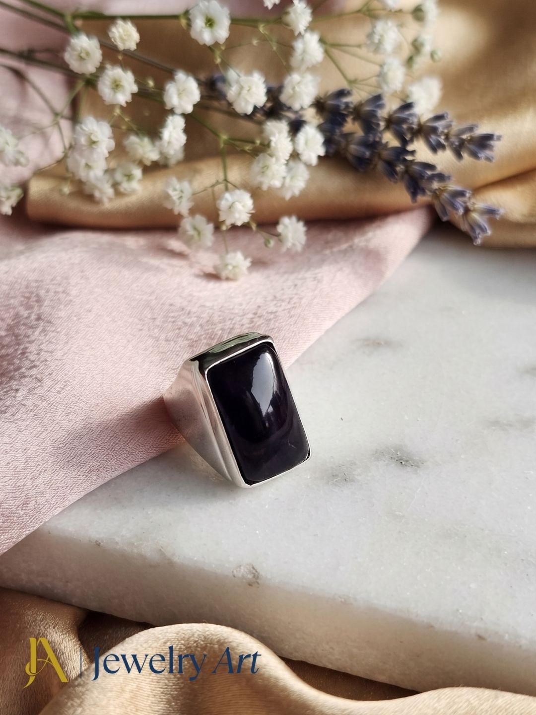 Natural Amethyst gemstone ring in silver plated GS displayed in a refined decorative jewelry arrangement with premium styling.
