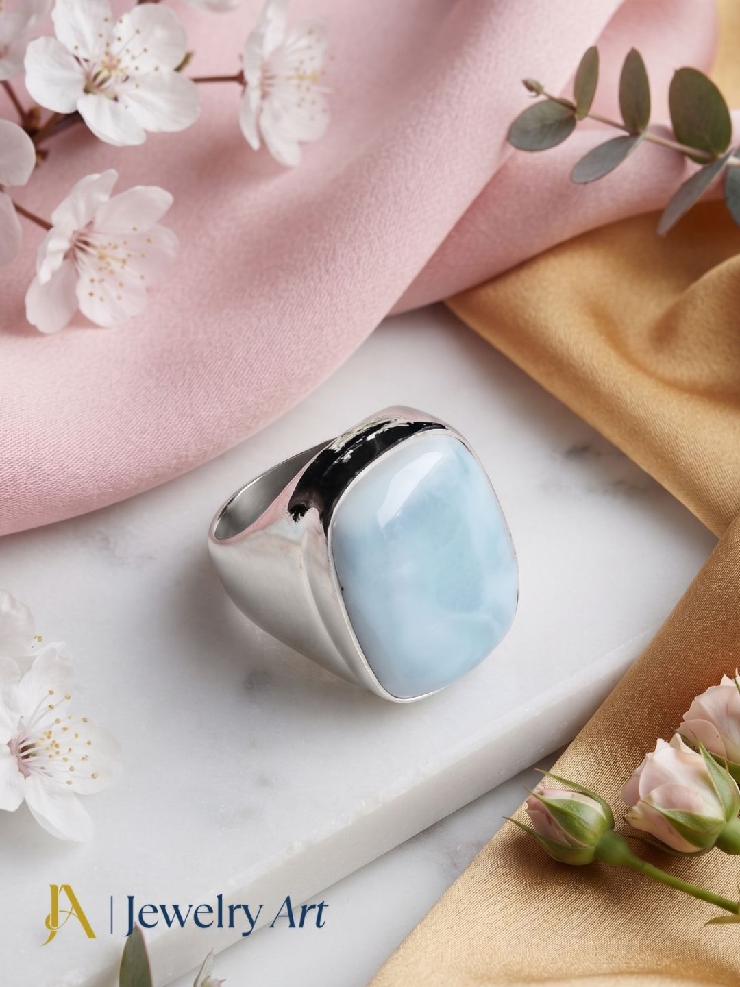 Decorative setup highlighting Natural Copper Larimar designer men's ring
