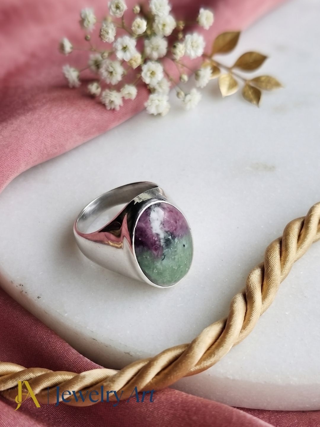 Natural Ruby Zoisite gemstone ring in silver plated GS displayed in a refined decorative jewelry arrangement with premium styling.
