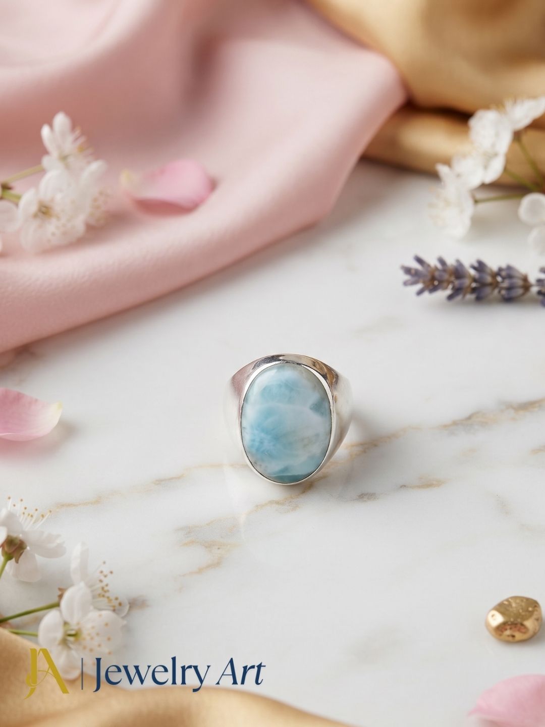 Designer natural Larimar gemstone silver plated GS ring showcased in a sophisticated decorative jewelry display highlighting artisan craftsmanship.
