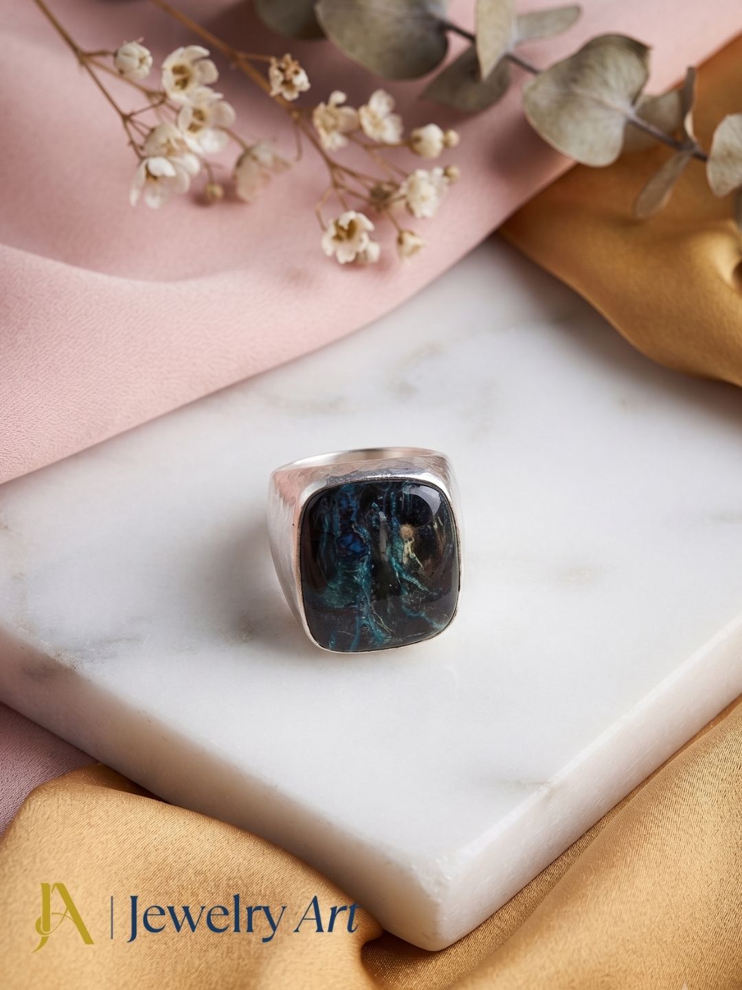 Artisan silver plated GS Picture Jasper gemstone ring displayed with elegant props for premium jewelry presentation.
