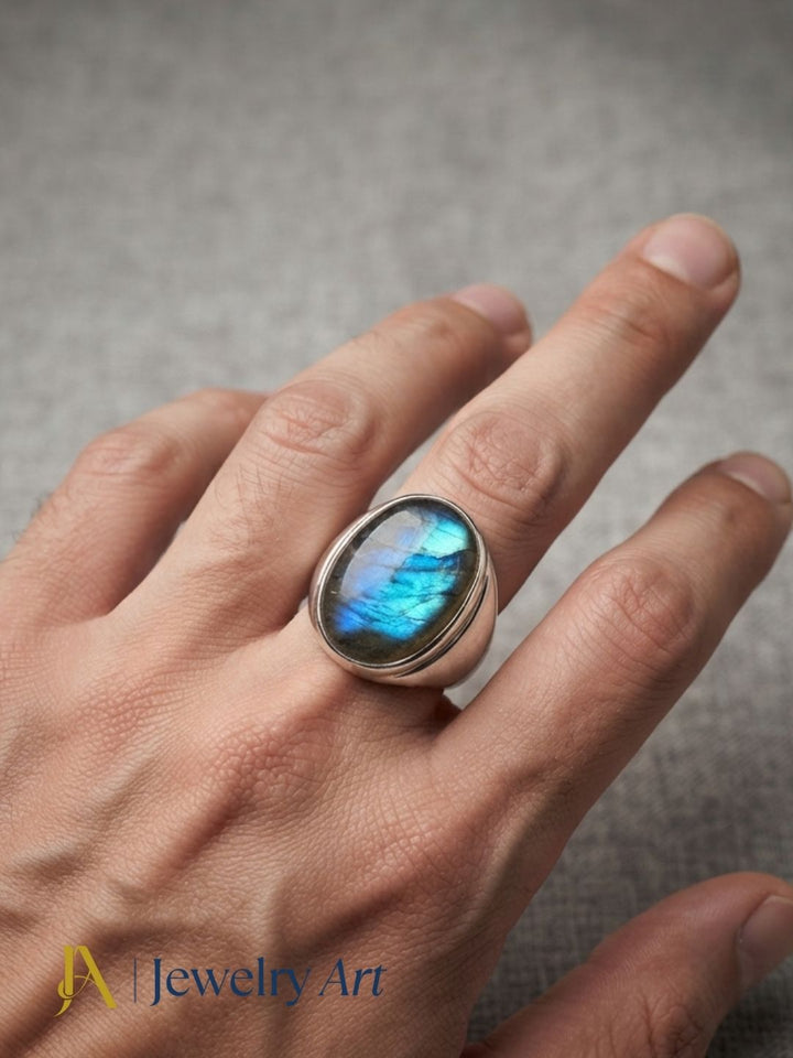 Fashion model showcasing a natural Labradorite gemstone handcrafted silver plated GS artisan ring with a contemporary look.
