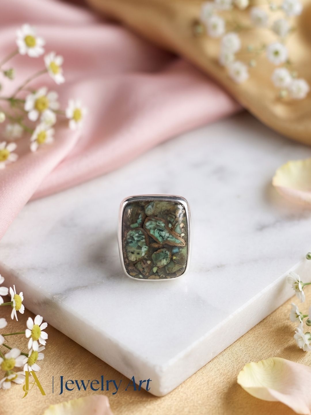Natural Copper Chrysocola gemstone ring in silver plated GS displayed in a refined decorative jewelry arrangement with premium styling.
