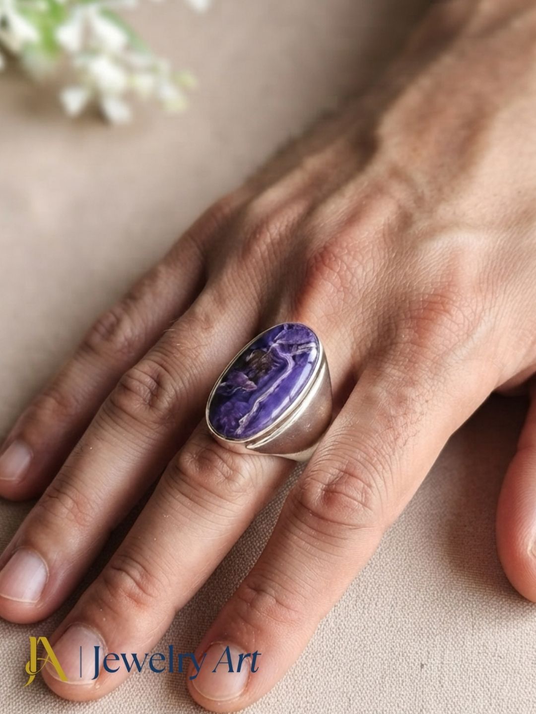 Fashion model showcasing a natural Charoite gemstone handcrafted silver plated GS designer statement ring.
