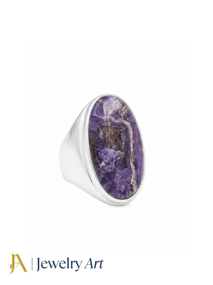 Premium natural Charoite gemstone ring for men crafted in silver plated GS, handcrafted statement ring isolated on a white background.

