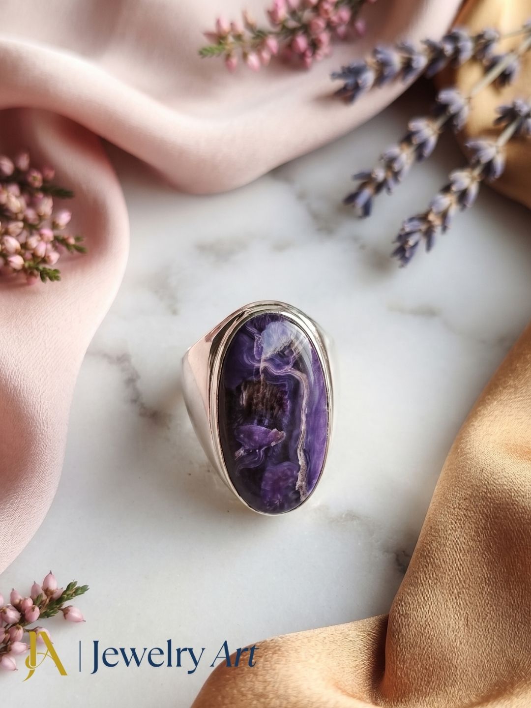 Natural Charoite gemstone ring in silver plated GS displayed in a refined decorative jewelry arrangement with premium styling.

