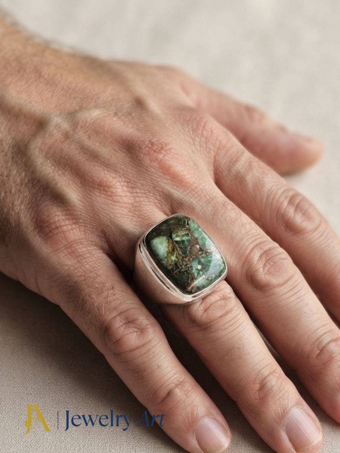 Hand model displaying a handmade Copper Chrysocola gemstone ring with premium silver plated GS artisan craftsmanship.
