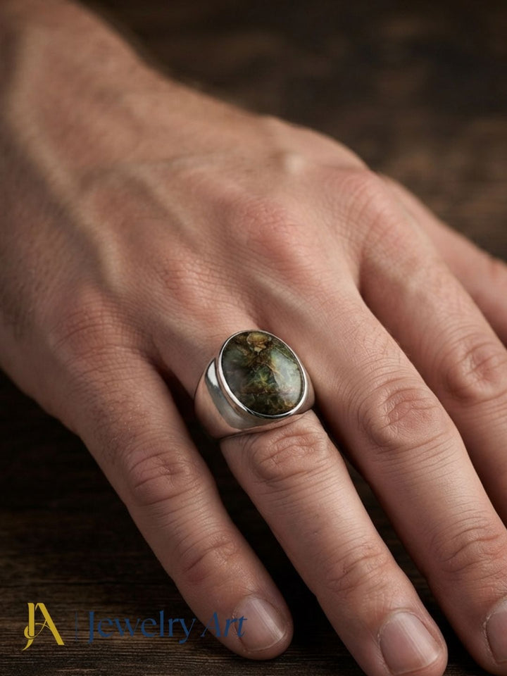 Male model wearing an artisan Copper Chrysocola gemstone silver plated GS designer statement ring, showcasing premium handcrafted craftsmanship with modern men's fashion styling.
