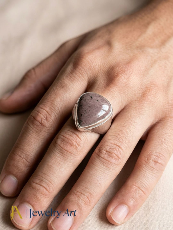 Close-up of man wearing handcrafted Natural Jasper gemstone ring
