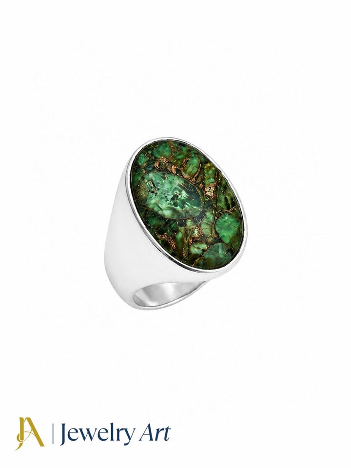 Hand model displaying a handcrafted Copper Chrysocola gemstone ring with premium silver plated GS craftsmanship and elegant styling.
