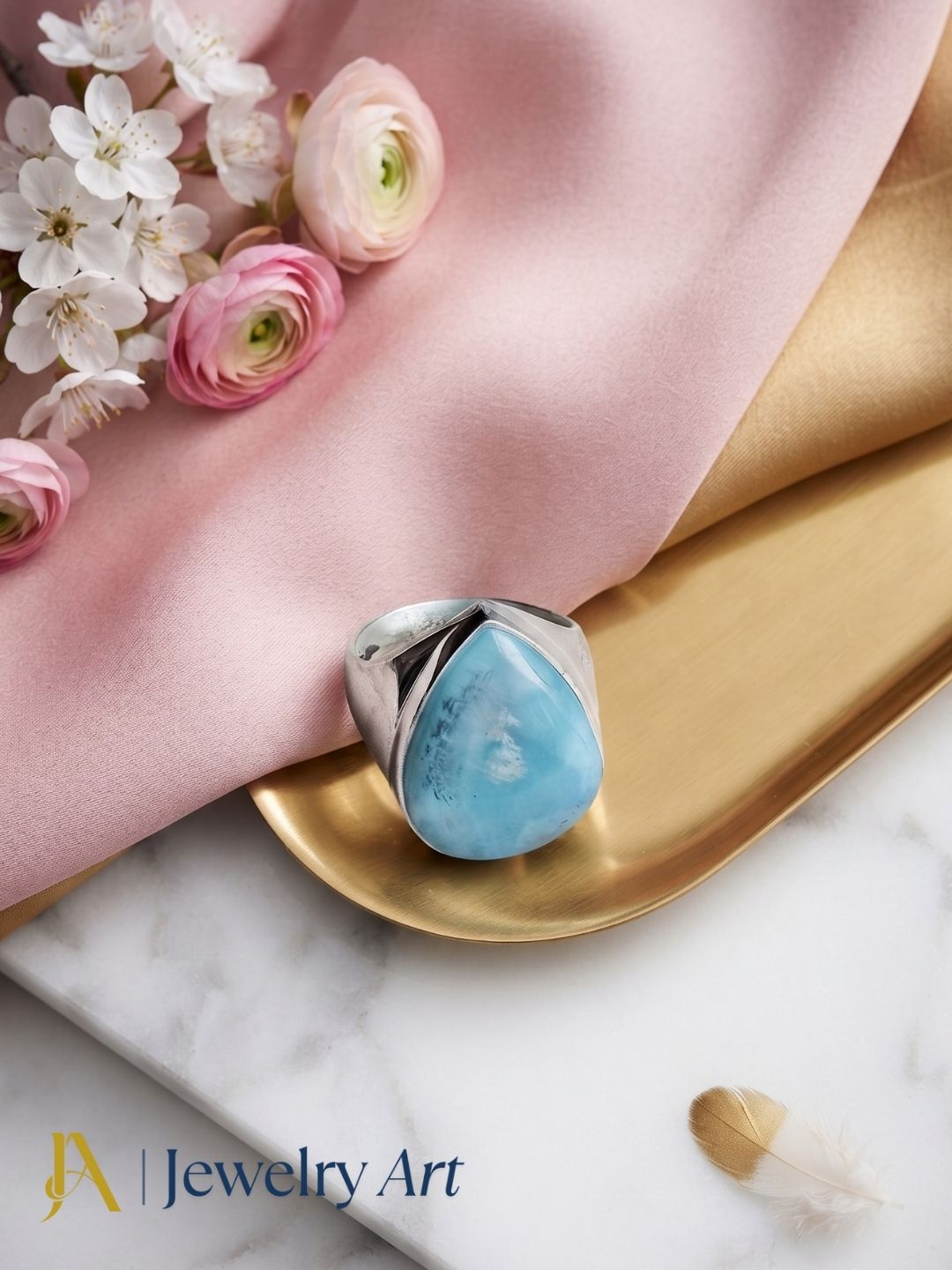 Handcrafted natural Larimar gemstone ring for men in Silver Overlay GS displayed in a luxury decorative jewelry setup with elegant props, highlighting the natural gemstone and artisan craftsmanship.

