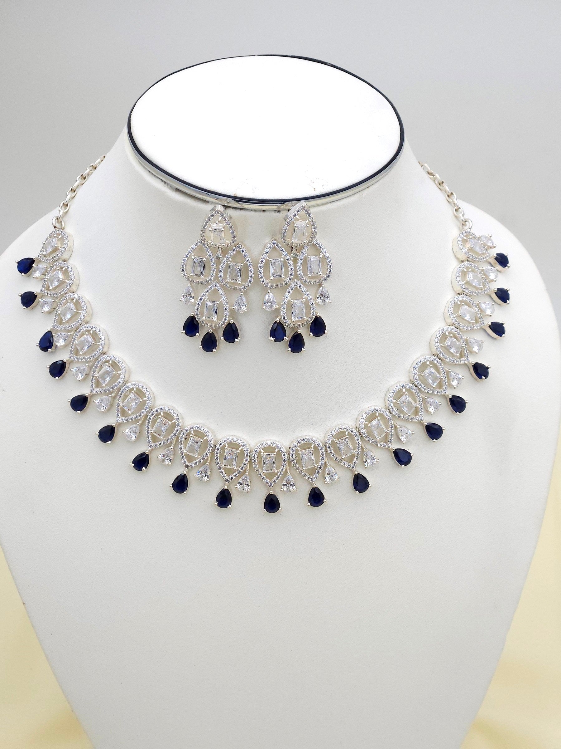 Detailed view of designer jewelry set featuring blue hydro quartz and sparkling cubic zirconia
