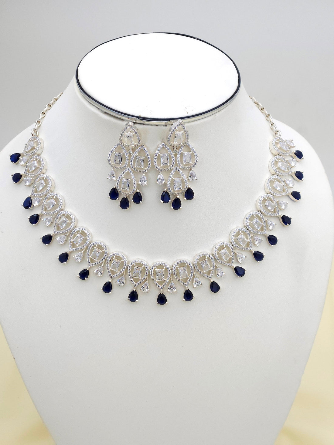 Detailed view of designer jewelry set featuring blue hydro quartz and sparkling cubic zirconia
