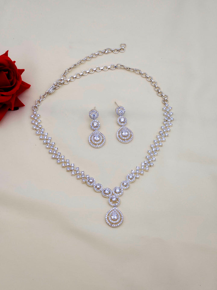Designer rhodium plated silver jewelry set featuring cubic zirconia necklace and matching earrings
