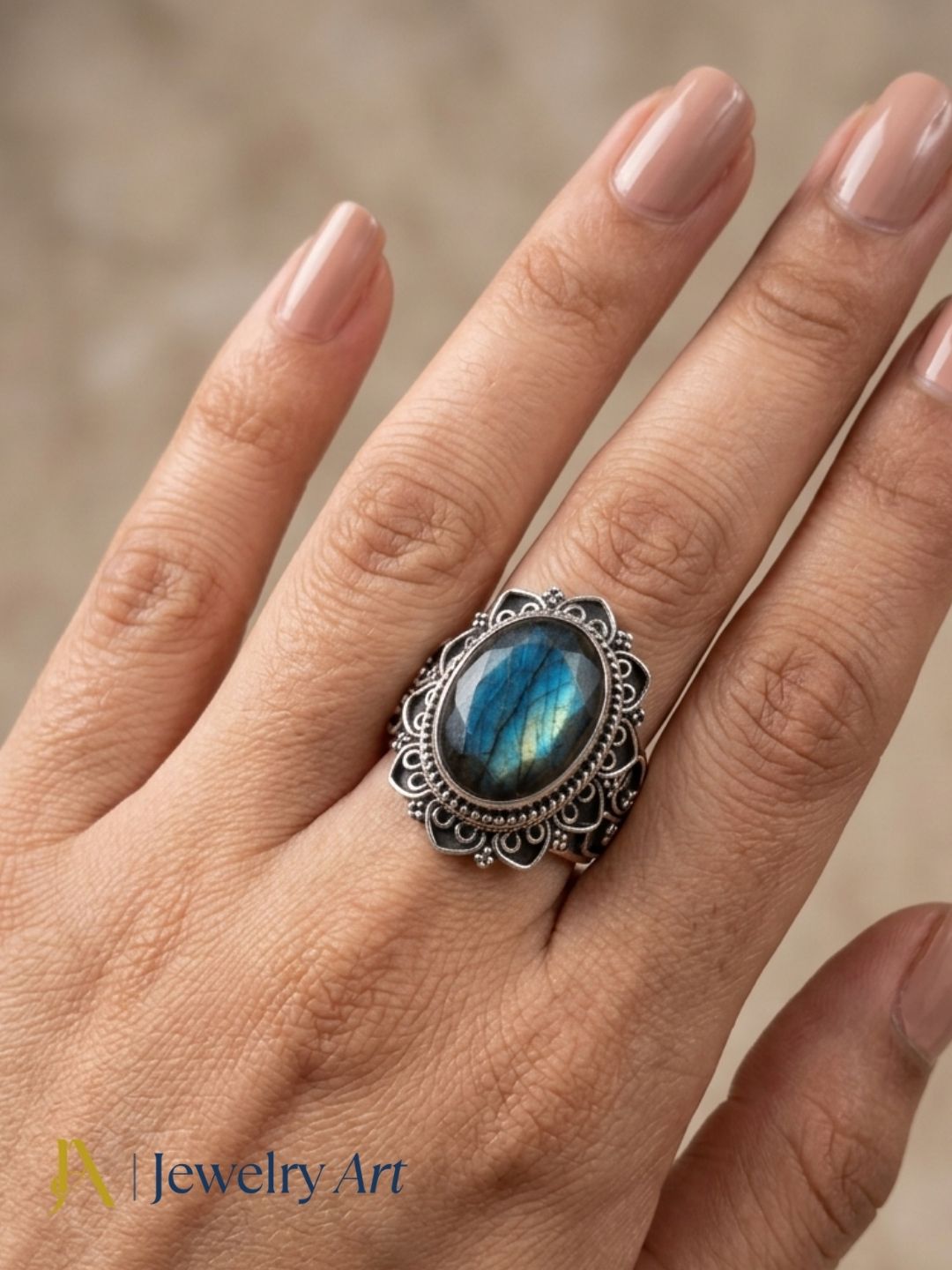 Model wearing artisan 925 oxidized silver Labradorite gemstone ring