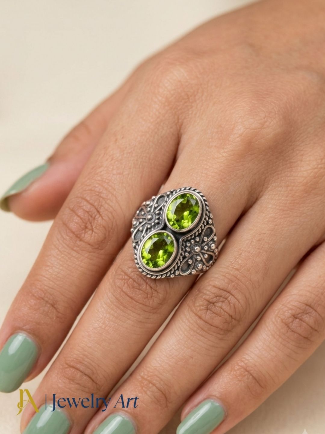 Luxury jewelry styling with handcrafted Peridot gemstone silver ring
