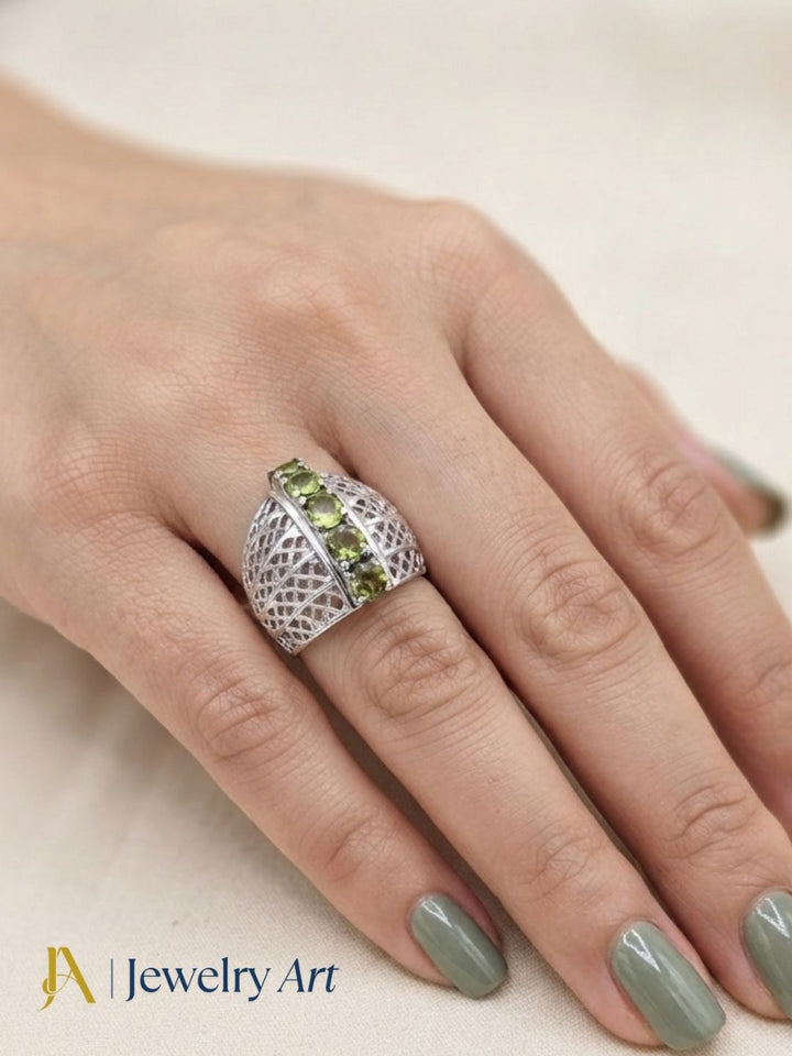 Model showcasing 925 silver Peridot semi-precious gemstone finger ring