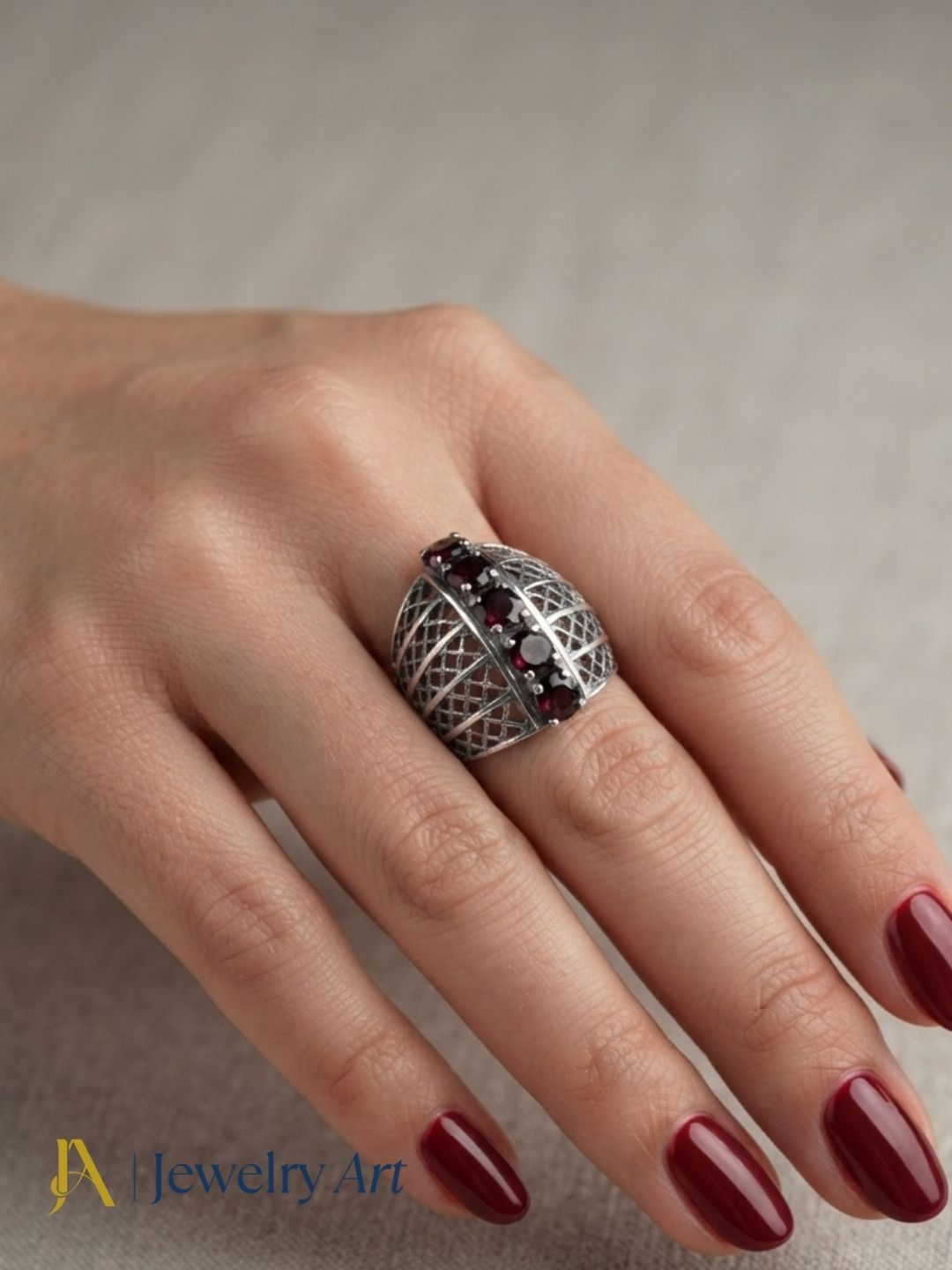 Fashion model wearing elegant 925 silver Garnet gemstone ring